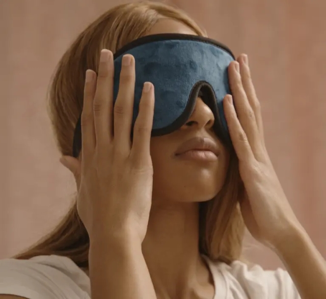 Woman holding face mask