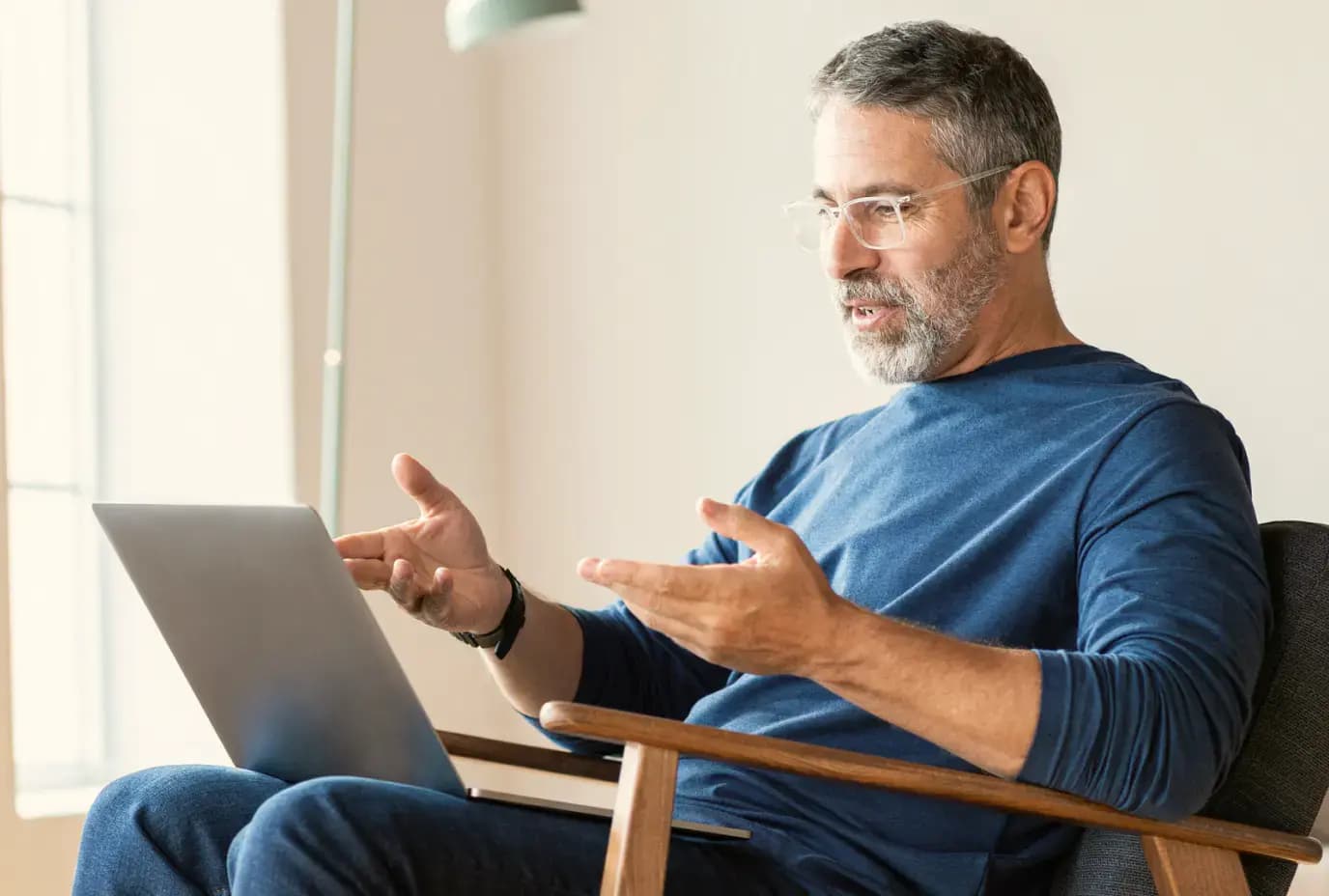 man speaking to computer giving consultation