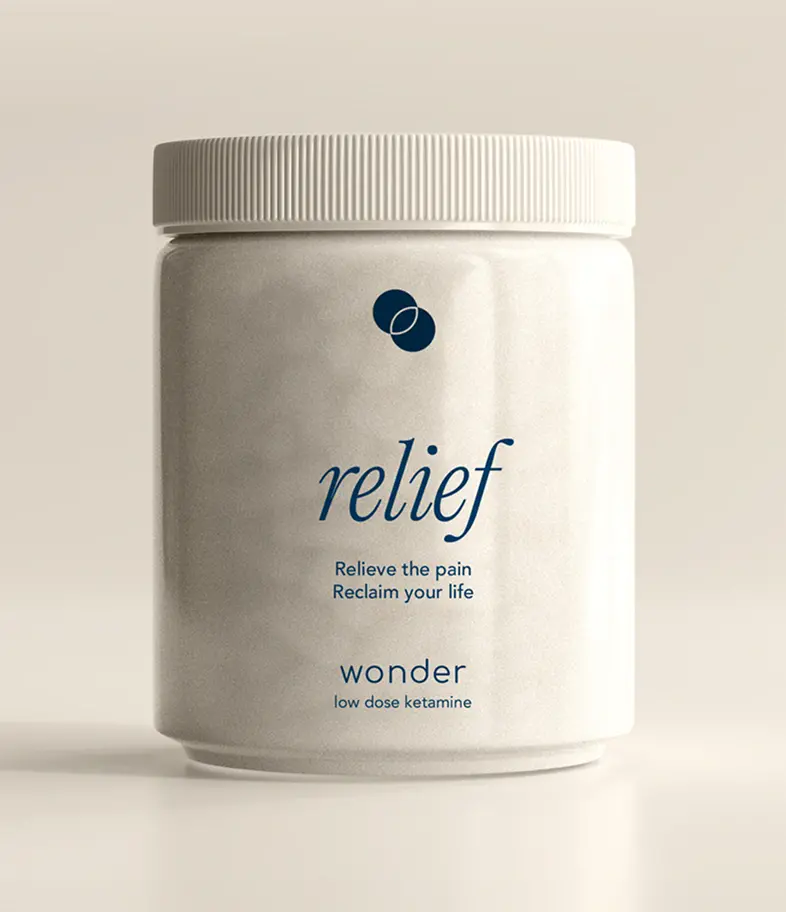Hand holding medicinal tablet